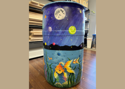Rain Barrel with fish in water and night sky artwork